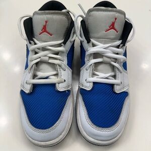 Air Jordan 1 Low SE sneakers blue, white, and black colorway size 3.5Y Logo